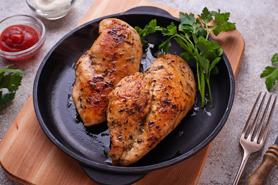 Grilled chicken breast with herbs, symbolizing a lean protein source.